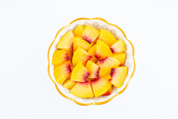 A plate of fresh yellow peach slices