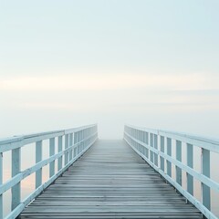 Obraz premium Serene pier extending into a foggy horizon, evoking calm and tranquility. Ideal for backgrounds, relaxation themes, and peaceful concepts.