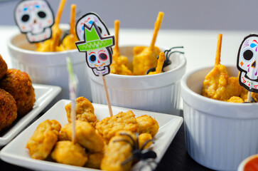 A plate of food with a skull decoration on it