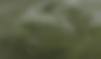 Gradient and grainy texture on a green metallic background
