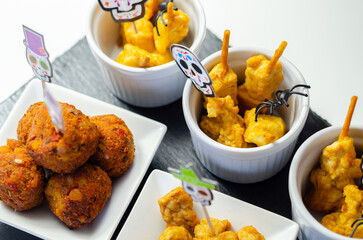A plate of food with a skull decoration on it