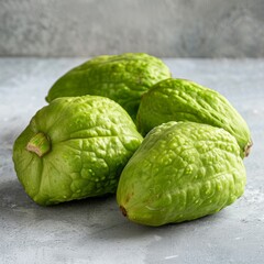 Fototapeta premium Fresh Green Chayote or Sicyos Edule also known as Christophine, Mirliton and Choko on Light Table