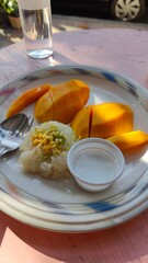 Local Thai dessert Mango with sticky rice and coconut milk