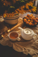 Pouring tea from a white teapot into a cup, with a bouquet of sunflowers in the background. The warm, soft lighting creates a cozy and calming atmosphere, perfect for a peaceful tea time