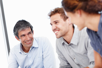 Fototapeta premium Business, staff planning and talking in office, teamwork and conversation for agency meeting. Employees, cooperation and confidence in workplace for discussion, brainstorming project and speaking
