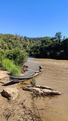 Sailing a local longtail boat on the Moei River between Thailand and Myanmar