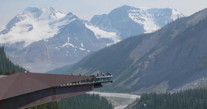 Visitors enjoying scenic view from Icefield Skywalk in Canada National Park