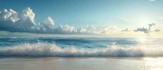 Tranquil ocean waves crashing on a sandy beach with a clear blue sky and fluffy clouds.