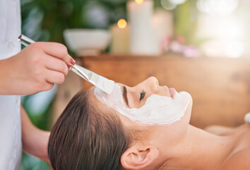 Woman, skincare and application of clay mask by beautician for cleansing, detox and dermatology....