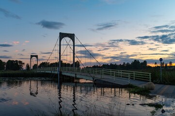 Bridge Day, National Construction Day, Builders Day Long. Roosisaare Bridge Connecting one Town in Voru Estonia. On Sunset Background