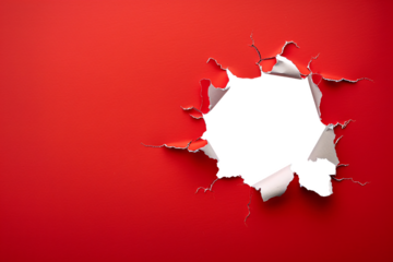 ripped transparent hole in red paper, torn hole
