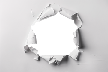 ripped transparent hole in white paper, torn hole