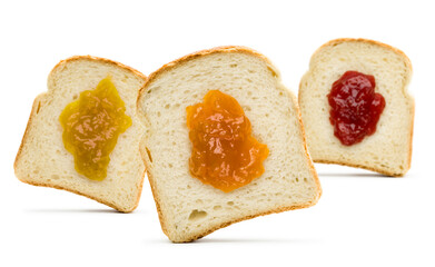 Slices of white bread front view with variety of jam on white background.