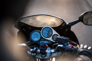 behind the back of a motor bike driver i the movement on the side road