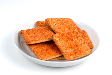 A stack of crackers with beef floss flavor. Isolated on white background. Perfect for design element, product packaging, promotion, or any commercial purposes.