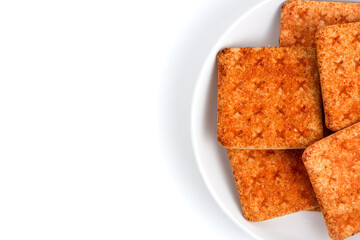 A stack of crackers with beef floss flavor. Isolated on white background. Perfect for design element, product packaging, promotion, or any commercial purposes.