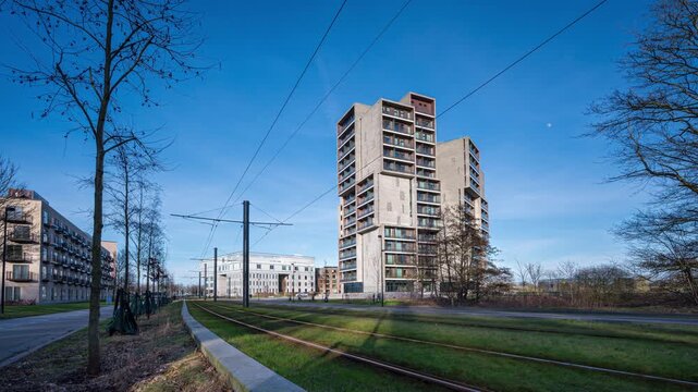 The newly built light rail line is passing a modern apartment building in Odense, third largest town in Denmark