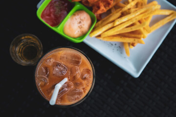 Ice Cafe Latte on table with black background.
