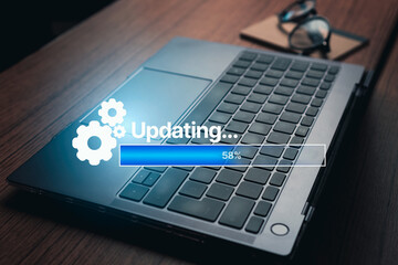 Laptop on desk home with update concept. Software upgrade interface with empty space for use.