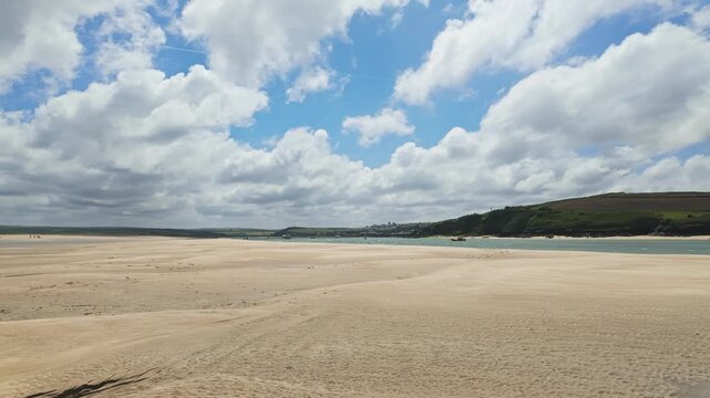 Pan, left to right from Daymer Bay towards Padstow at low tide, sand in foreground