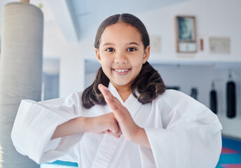 Portrait, karate and happy girl child learning taekwondo for self defense or fight in class. Face,...