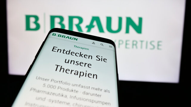 Stuttgart, Germany - 07-31-2024: Mobile phone with webpage of Germany pharmaceutical device company B. Braun SE in front of business logo. Focus on top-left of phone display.
