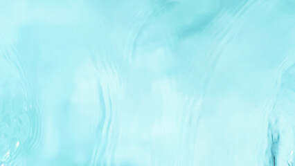 Freeze motion of splashing water surface on light blue background