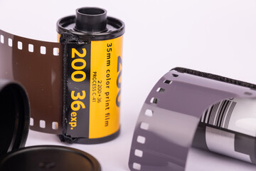 Detailed view of antique film reels on a clean white backdrop. Showcasing the intricate design and historical charm of classic cinema equipment.