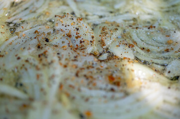 fried onion background, in a pan with seasonings and spices, cooking, selective focus
