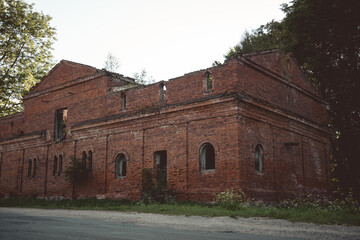 A dilapidated brick stable building. 19th century buildings