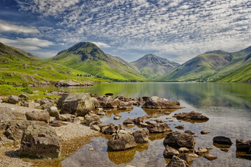 Reflections of the rocks in the clear waters of Wastwater at Wasdale, The Lake District in Cumbria...