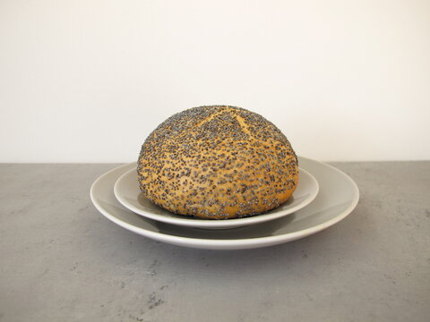 A poppy seed roll on a plate