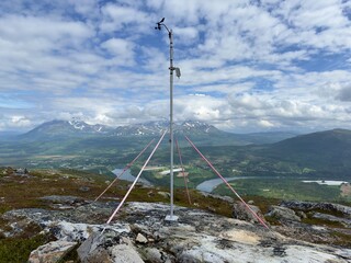 Weather station on top of Nordic Mountain looking over valley forecasting weather