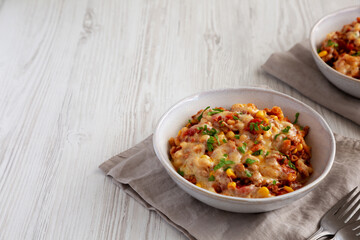 Homemade One-Pot Cheesy Taco Pasta in a Bowl, side view. Copy space.