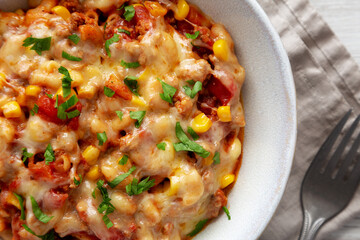 Homemade One-Pot Cheesy Taco Pasta in a Bowl, top view. Close-up.