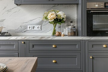 A decorative vase filled with fresh flowers sits on a modern kitchen counter