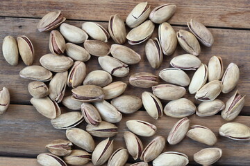 pistachio nuts on wooden background