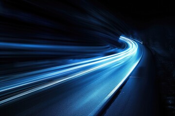 A blurred image of a highway with cars passing by in the dark of night, perfect for use as a background or to represent nighttime travel