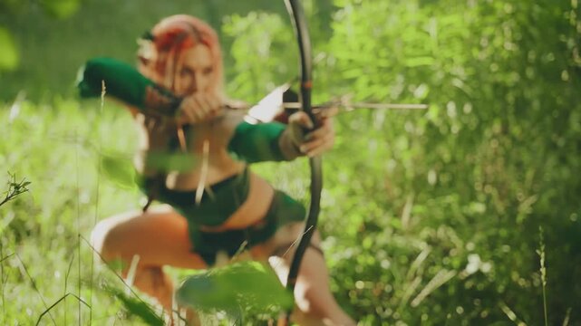 Fantasy strong warrior woman amazon hunts in fairy tale mystery forest green grass sun light, sexy eyes girl hunter holds long bow in hands aims arrow. braid orange hair. fashion model posing art 4k