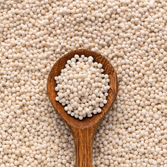 Starch tapioca pearls on the spoon - Manihot esculenta.