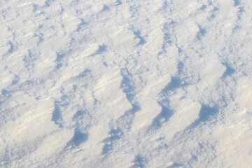 The texture of the snow, which lies in layers, in sunny weather