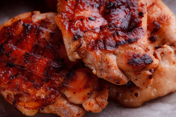 Top view of grilled pork steak in caramelized sauce. Serving meat on eco-friendly wooden utensils. Detailed meat texture.