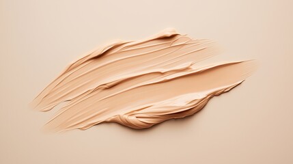 A creamy textured foundation swatch applied on a smooth surface for makeup demonstration