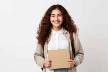 Obraz premium Smiling student holding notebook