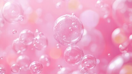 Soap bubbles floating on a pink background creating a dreamlike atmosphere