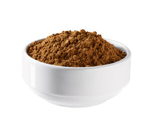 cinnamon powder in a ceramic bowl isolated on a white background.