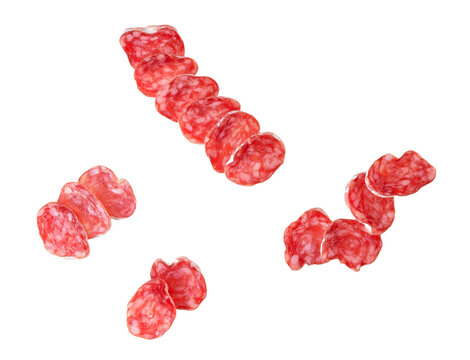 Slices of delicious spanish sausage fuet  isolated on a white background, top view.