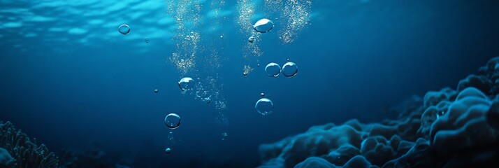 Naklejka premium Undersea Tranquility: The Serene Vista of Bubbles Rising Through the Deep Blue Ocean, Capturing the Peace and Mystery of the Seabed World
