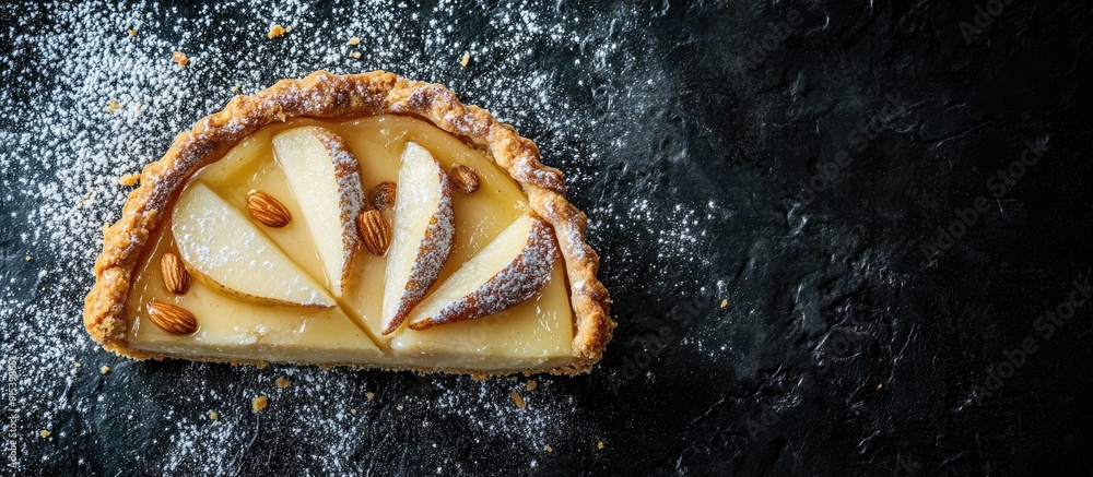 Poster Slice of pear almond cream tart Dark background top view copy space