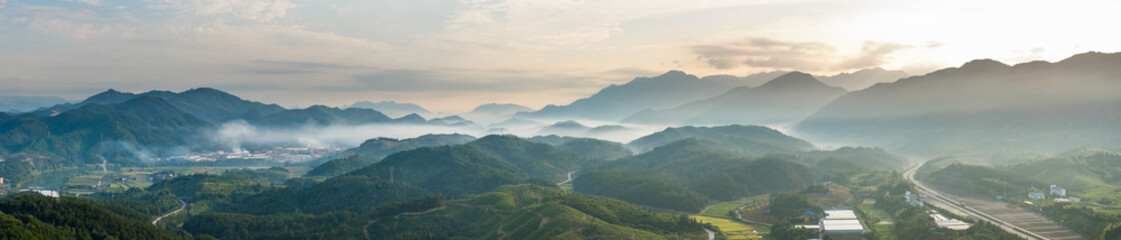 view of green mountains in fog